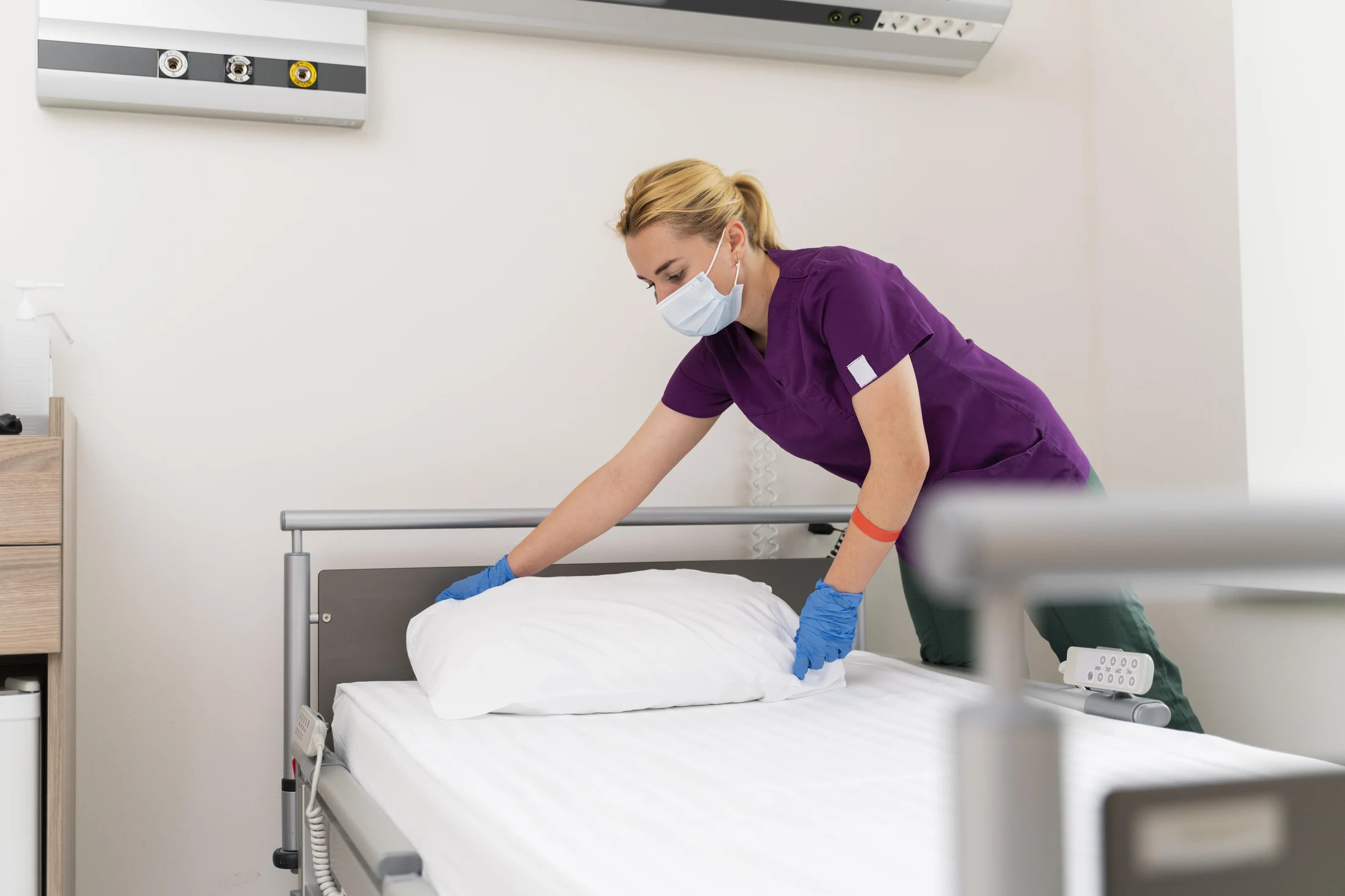 Fresh hospital sheets being prepared