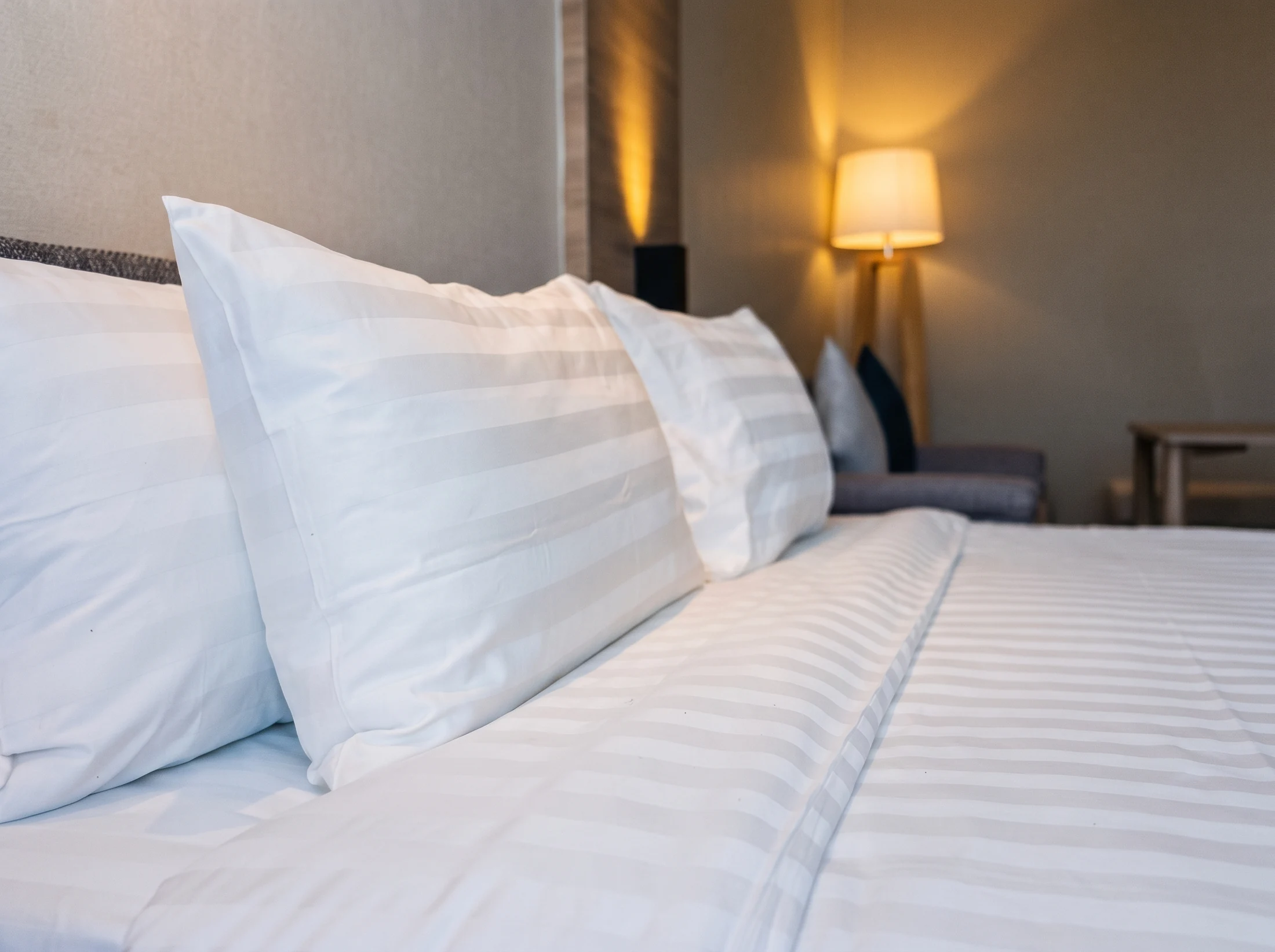 High-quality white hotel bedding in a guest room